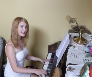 A woman taking piano lessons